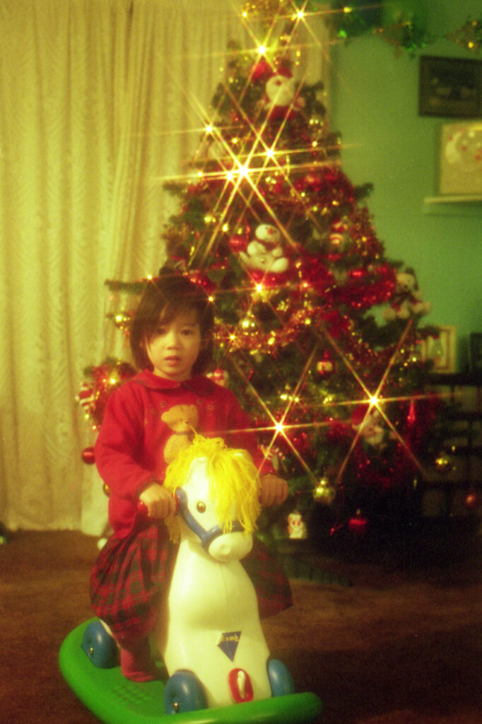 A younger me enjoys Christmas